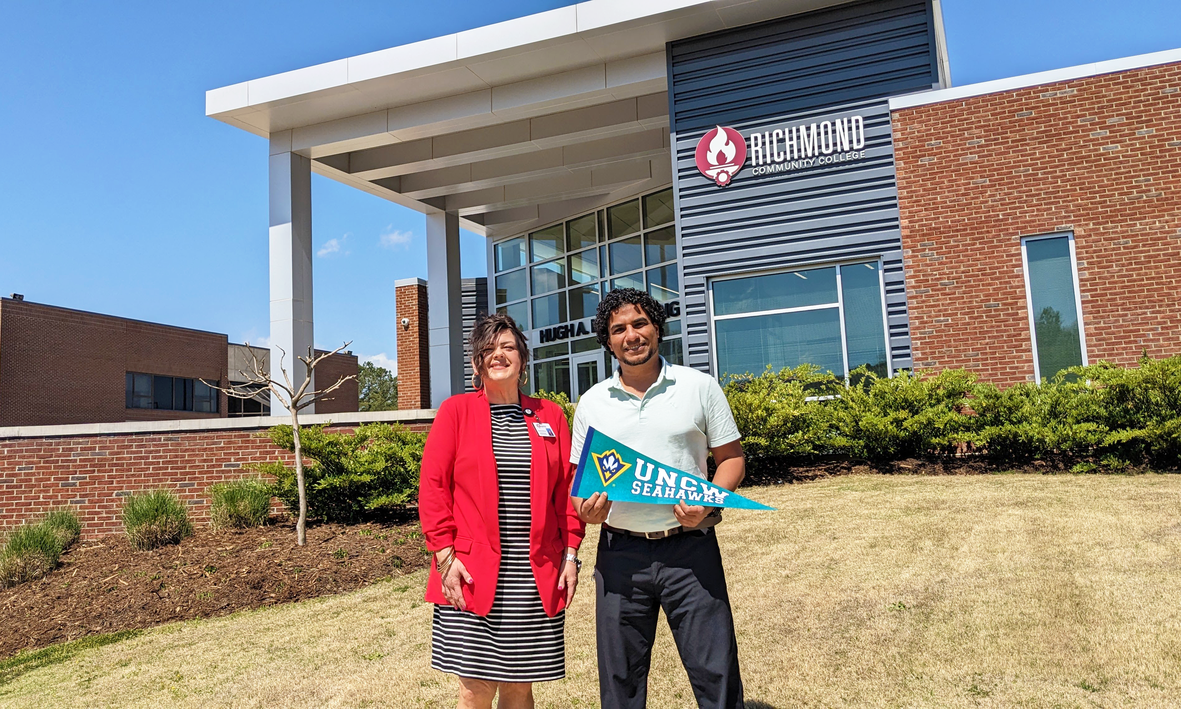 Aussem Hussien stands with Human Services Program Coordinator Amanda McKenzie